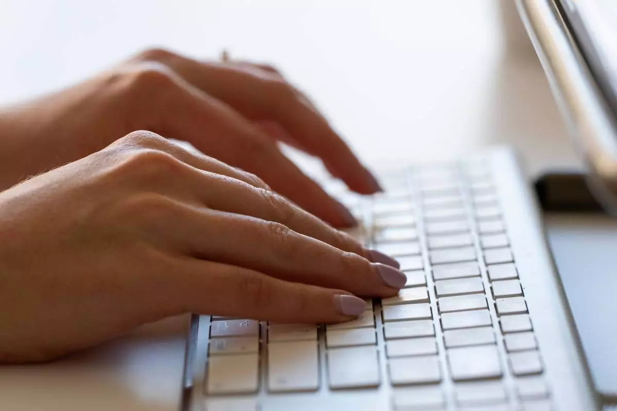 FILE - A person types on a keyboard on June 6, 2024, in Portland, Ore. (AP Photo/Jenny Kane, File)