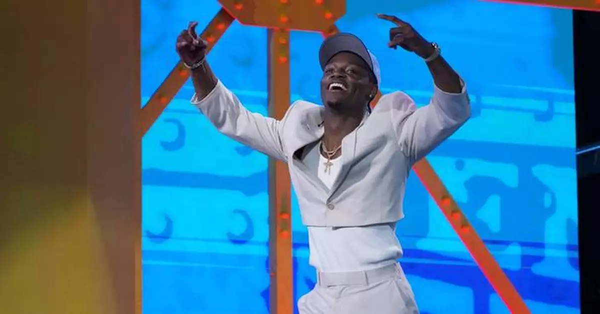 The Titans take receiver Carnell Tate at No. 4, trade up for edge rusher Keldric Faulk