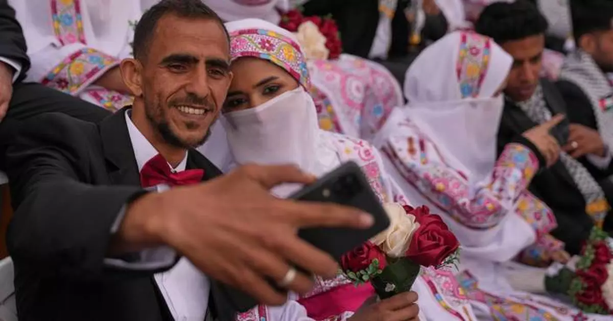 Photos show Palestinian couples celebrating a mass wedding in Gaza