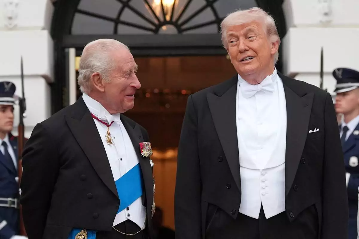 President Donald Trump greets Britain's King Charles III at the South Portico of the White House for a State Dinner Tuesday, April 28, 2026, in Washington. (AP Photo/Alex Brandon)
