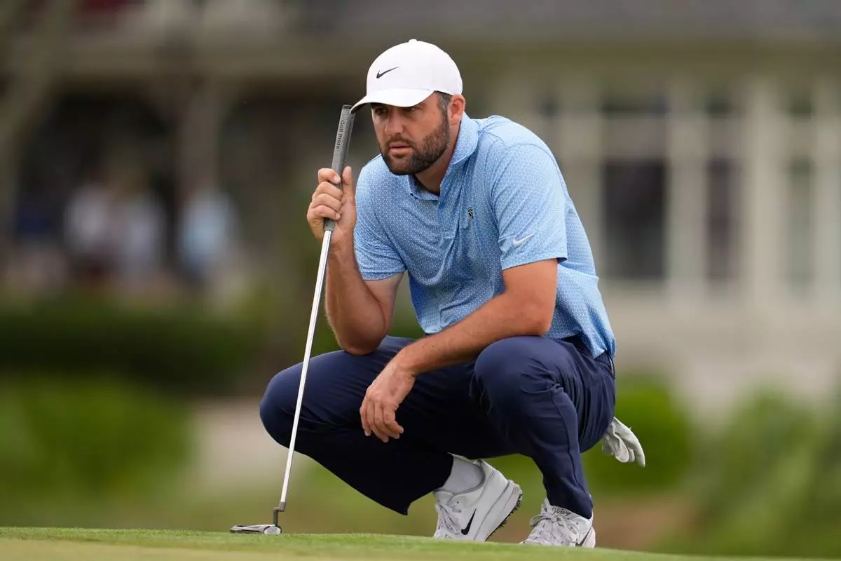 Scottie Scheffler prepares to putt on the 17th hole during the final round of the RBC Heritage golf tournament Sunday, April 19, 2026, in Hilton Head, S.C. (AP Photo/Mike Stewart)