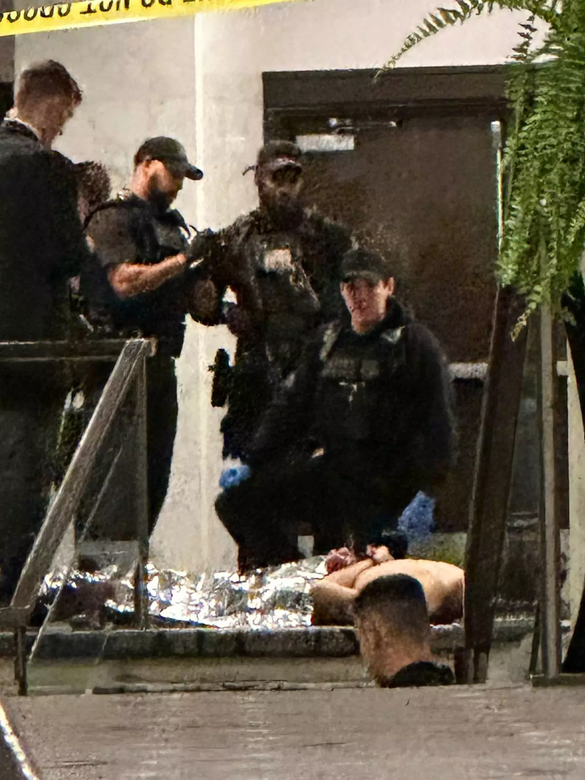 Members of law enforcement control shooting suspect Cole Tomas Allen during the White House Correspondents Dinner, Saturday, April 25, 2026, in Washington. (AP Photo/Alex Brandon) ADDITION: Adds name of shooting suspect after name shared by law enforcement officials