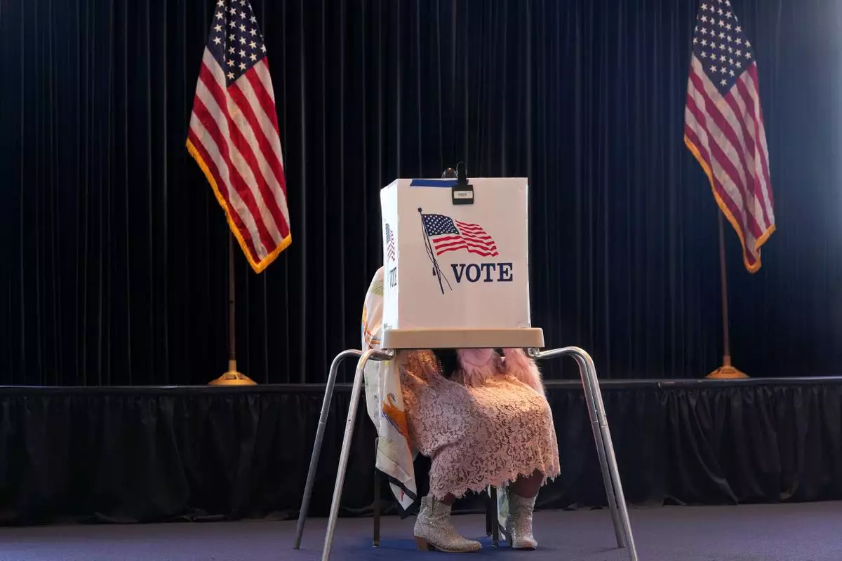 FILE - A voter prepares a ballot at a polling place at the Ronald Reagan Presidential Library on Election Day, Tuesday, Nov. 5, 2024, in Simi Valley, Calif. (AP Photo/Chris Pizzello, File)