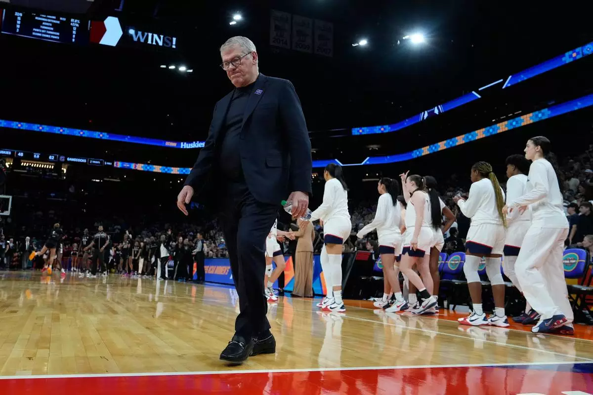 UConn head coach Geno Auriemma reacts after during the second half of a woman's NCAA college basketball tournament semifinal game between UConn and South Carolina at the Final Four, Friday, April 3, 2026, in Phoenix. (AP Photo/Ross D. Franklin)
