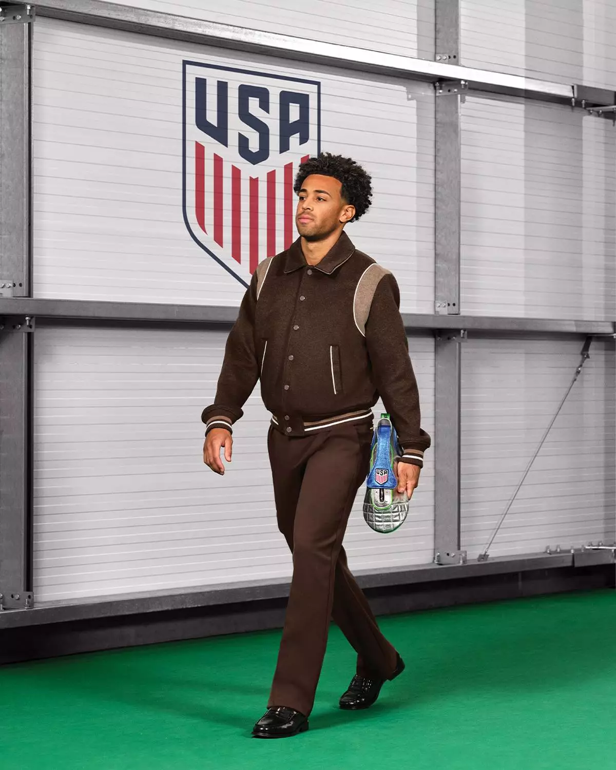 U.S. Men’s National Team midfielder, Tyler Adams carries the limited-edition Tunnel Walk Bag, a cleat-inspired dopp kit that merges style with wellness and totes essentials like Advil and Sensodyne.