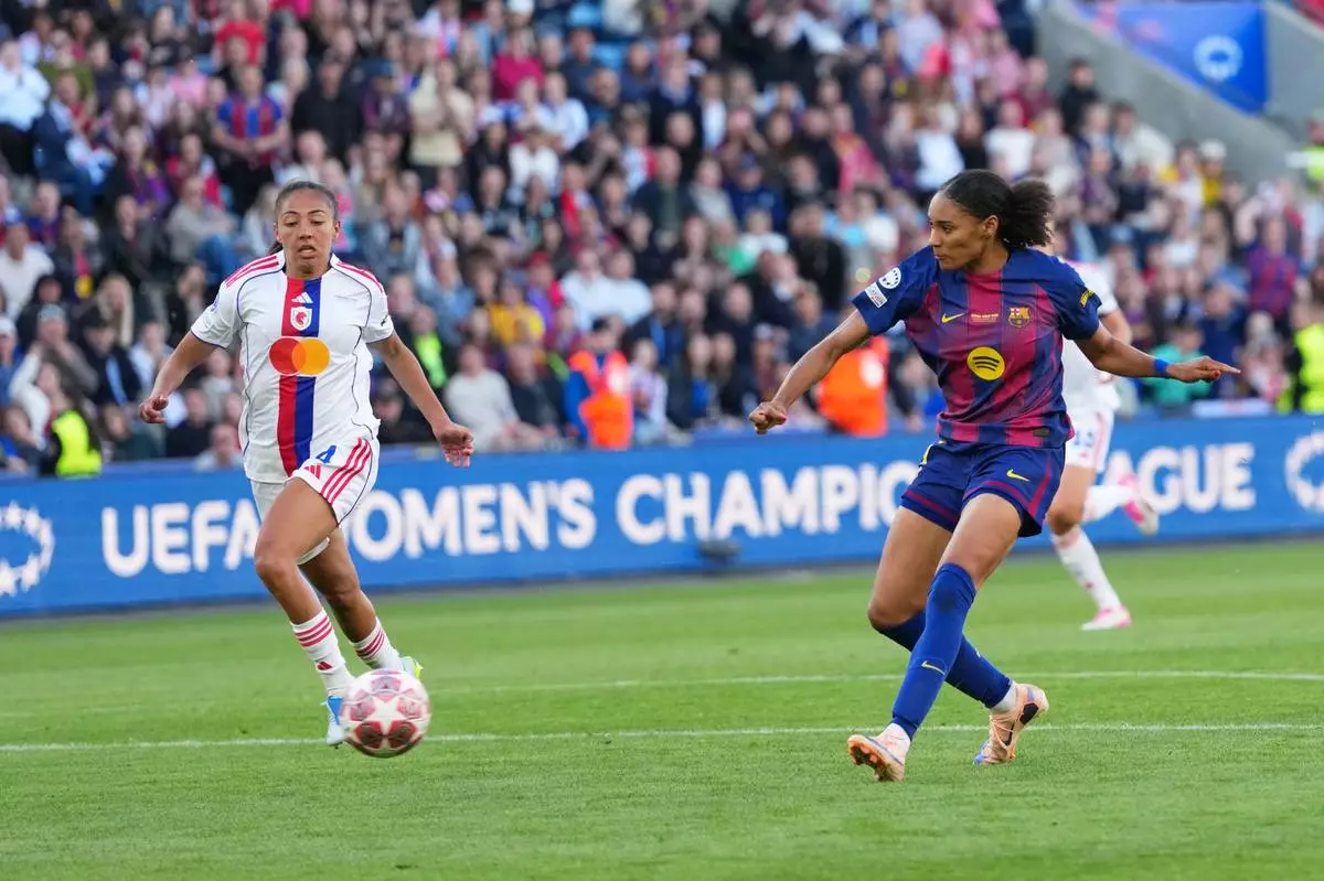 Barcelona's Salma Paralluelo scores her side's fourth goal during the Women's Champions League final soccer match between FC Barcelona and OL Lyonnes, in Oslo, Saturday, May 23, 2026. (AP Photo/Kirsty Wigglesworth)