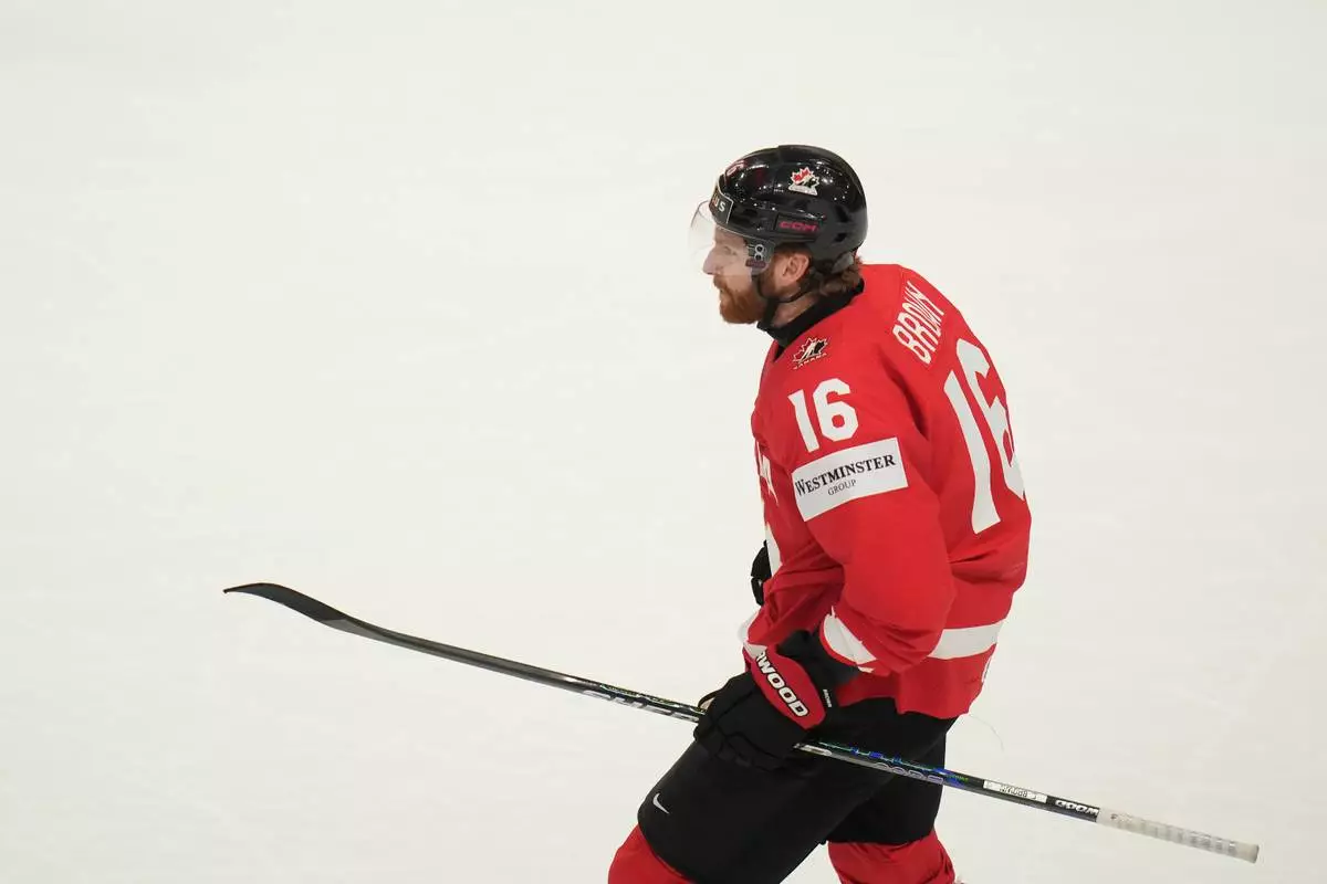Canada's Connor Brown (16) celebrates after scoring a goal during the third period of the 2026 IIHF Men's Ice Hockey World Championship quarterfinal match between Canada and United States, in Fribourg, Switzerland, Thursday, May 28, 2026. (AP Photo/Darko Bandic)