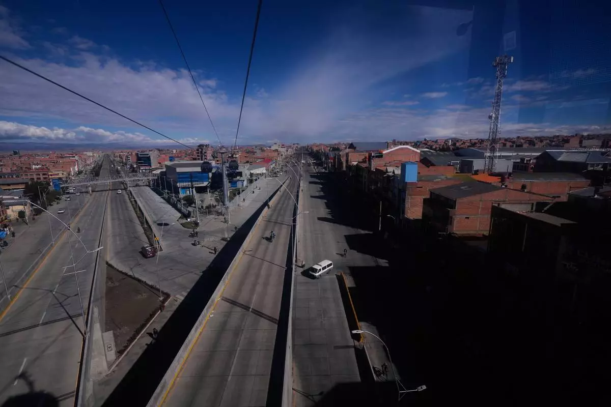 FILE - Highways are free of traffic due to Aymara farmers blocking the roads during an anti-government protest in El Alto, Bolivia, May 13, 2026. (AP Photo/Juan Karita, File)