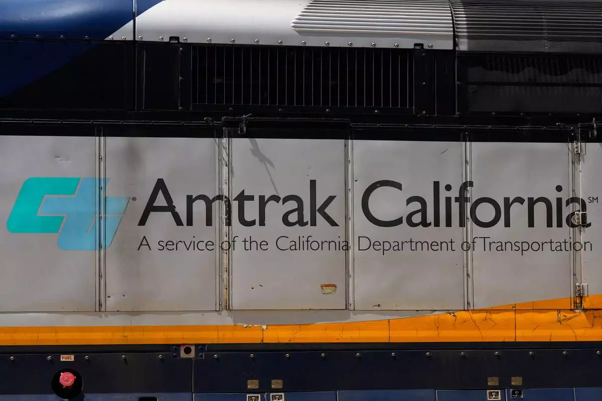 An Amtrak train leaves a station in Emeryville, Calif., Thursday, April 30, 2026. (AP Photo/Jeff Chiu)