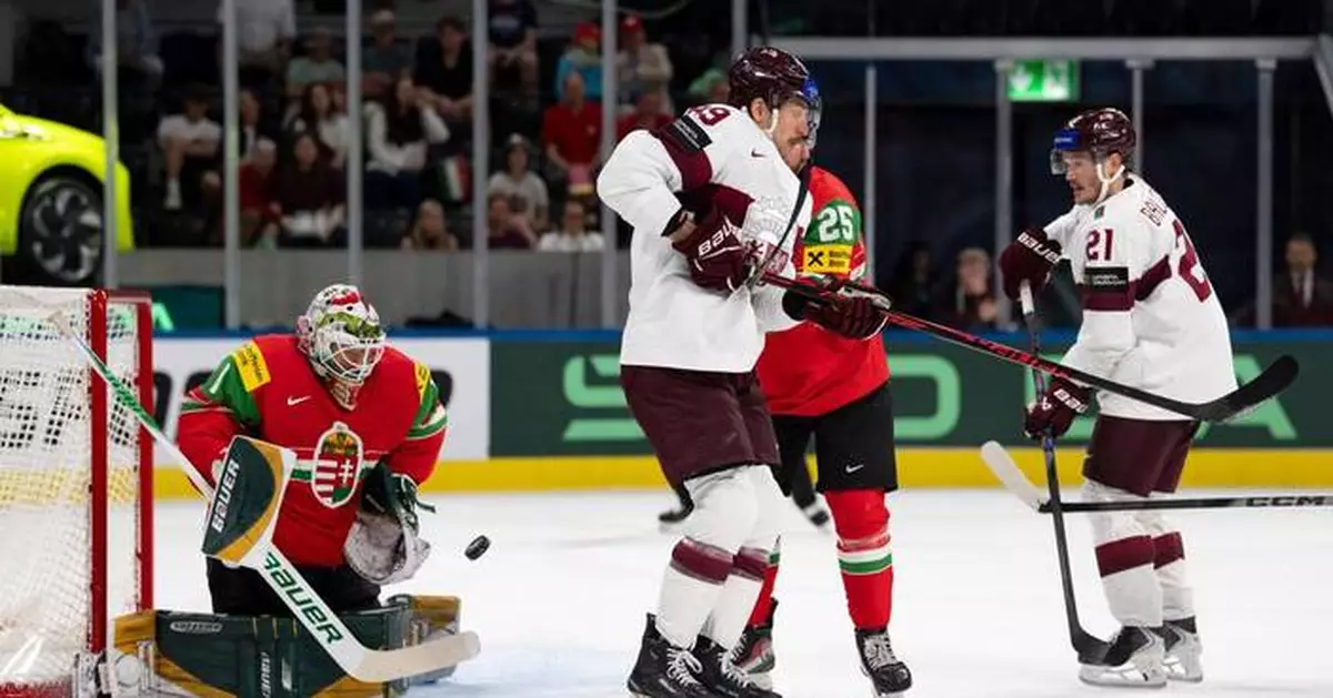 Latvia routs Hungary 8-1 to reach quarterfinals at ice hockey worlds