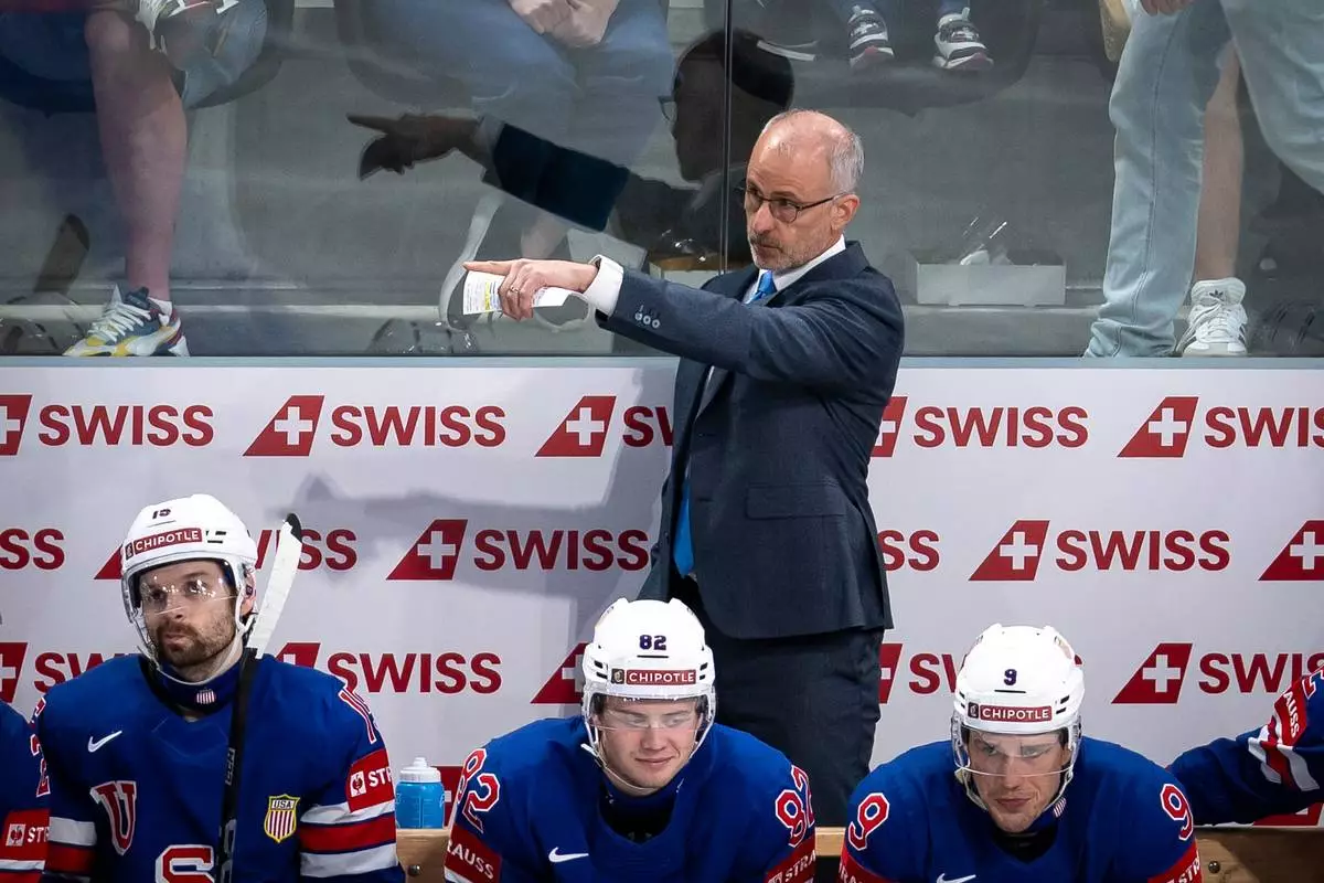 USA's head coach Don Granato, rear, points during the 2026 IIHF Men's Ice Hockey World Championship preliminary round group A match between United States and Austria in Zurich, Switzerland, Tuesday, May 26, 2026. (Andreas Becker/Keystone via AP)