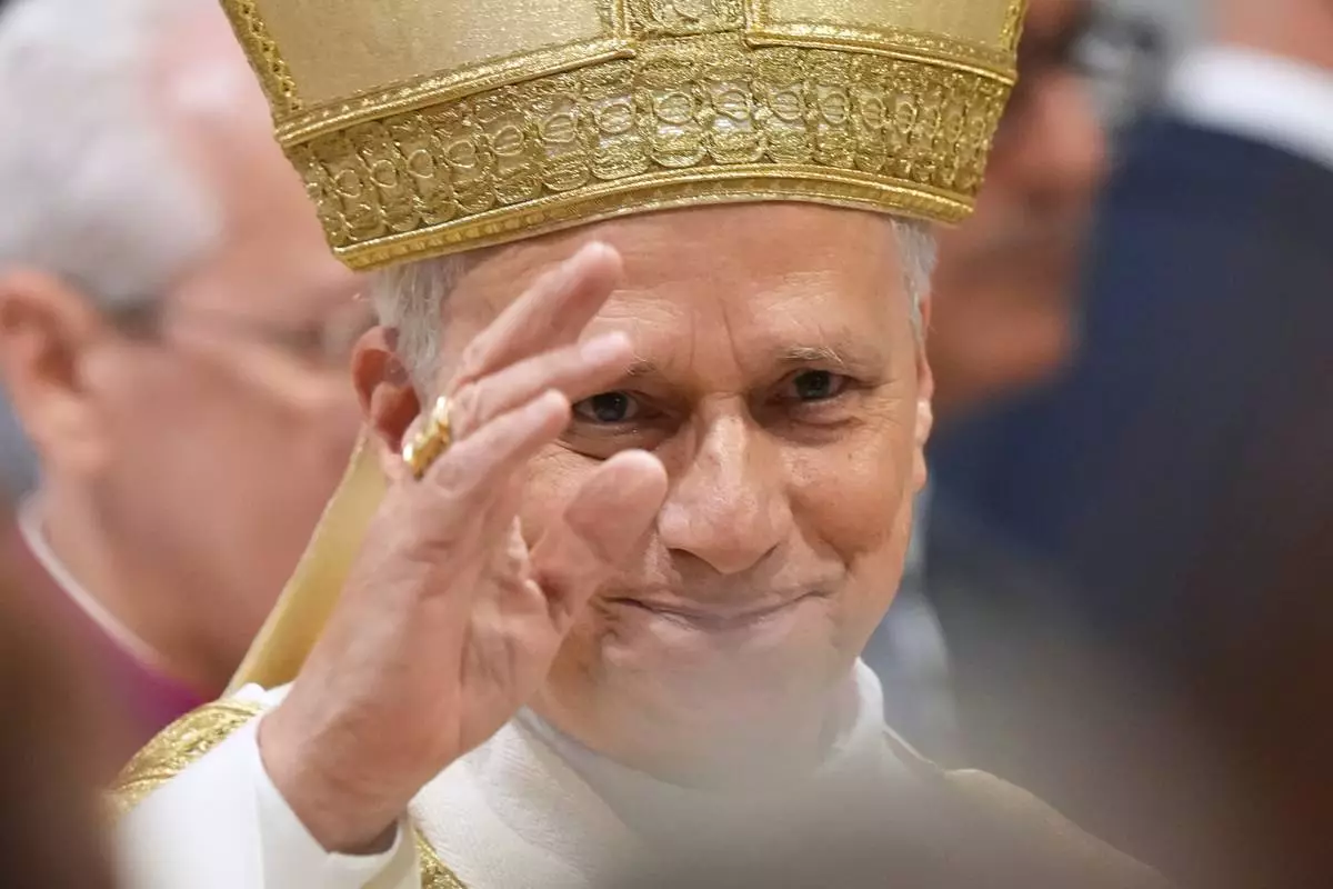 Pope Leo XIV waves after presiding over the ordination of four Auxiliary Bishops of Rome, in Rome's St. John Lateran Basilica, Saturday, May 2, 2026. (AP Photo/Andrew Medichini)