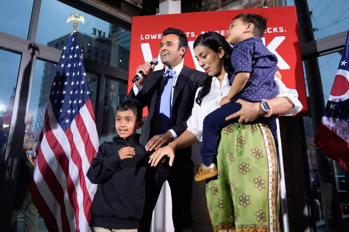 Republican Ohio gubernatorial candidate Vivek Ramaswamy, alongside his sons, Karthik and Arjun, and his wife, Apoorva Ramaswamy, speaks during a watch party at the Spruce St. Sporting sports bar after winning the party?s nomination for governor Tuesday, May 5, 2026, in Columbus. (AP Photo/Carolyn Kaster)