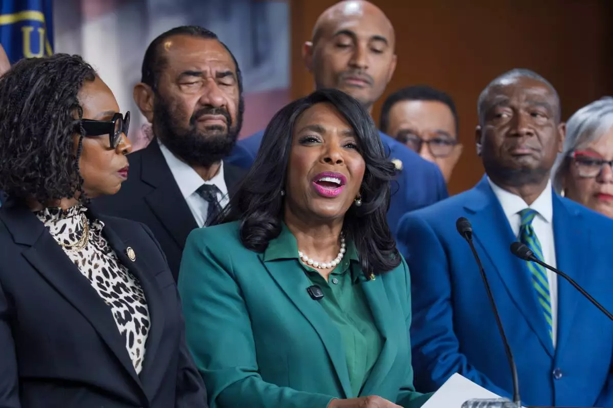 FILE—Rep. Terri Sewell, D-Ala., center, is surrounded by members of the Congressional Black Caucus as they speak to reporters in the wake of the Supreme Court ruling to strike down a majority Black congressional district in Louisiana, at the Capitol in Washington, Wednesday, April 29, 2026. (AP Photo/J. Scott Applewhite, File)
