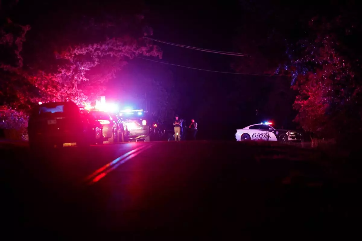 Police block off near S. Air Depot boulevard in Edmond, Okla., after a campground shooting at Lake Arcadia, Sunday, May 3, 2026. (AP Photo/Alonzo Adams) CORRECTION: Corrects day
