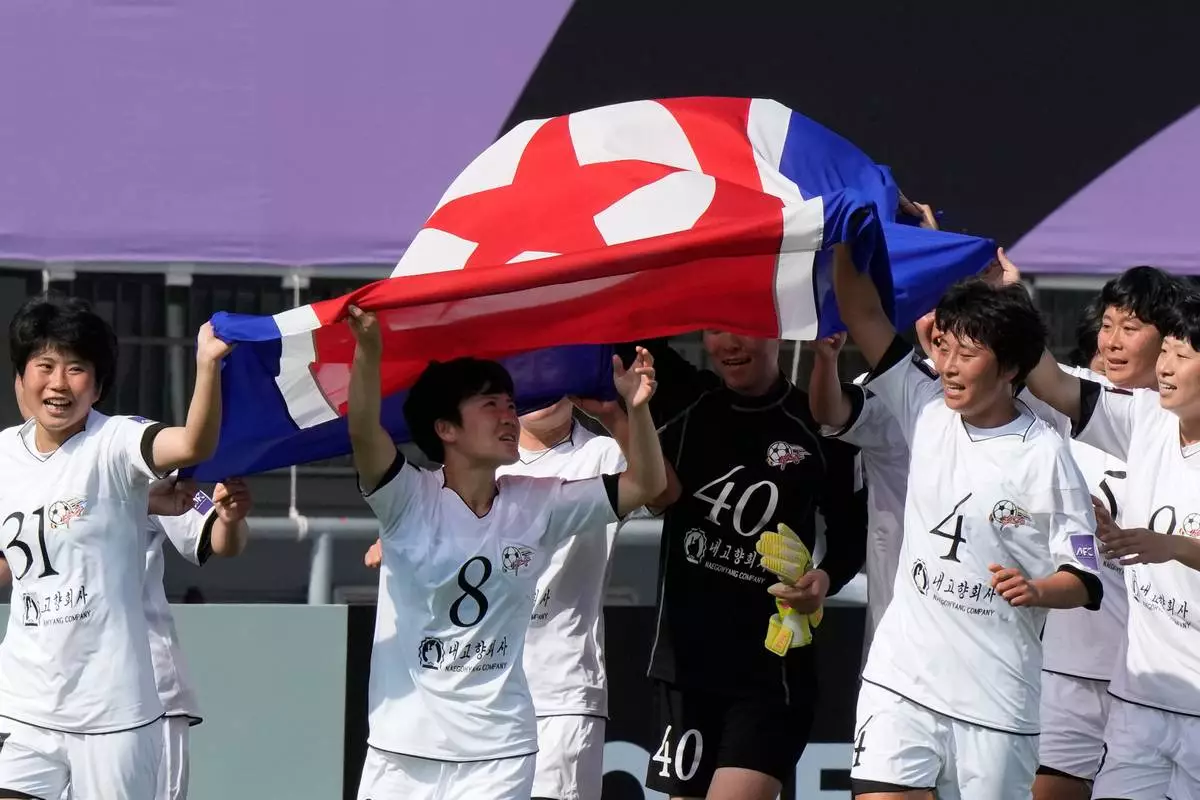 Naegohyang Women's FC's players celebrate after winning the AFC Women's Champions League soccer final match against Tokyo Verdy Beleza in Suwon, South Korea, Saturday, May 23, 2026. (AP Photo/Ahn Young-joon)