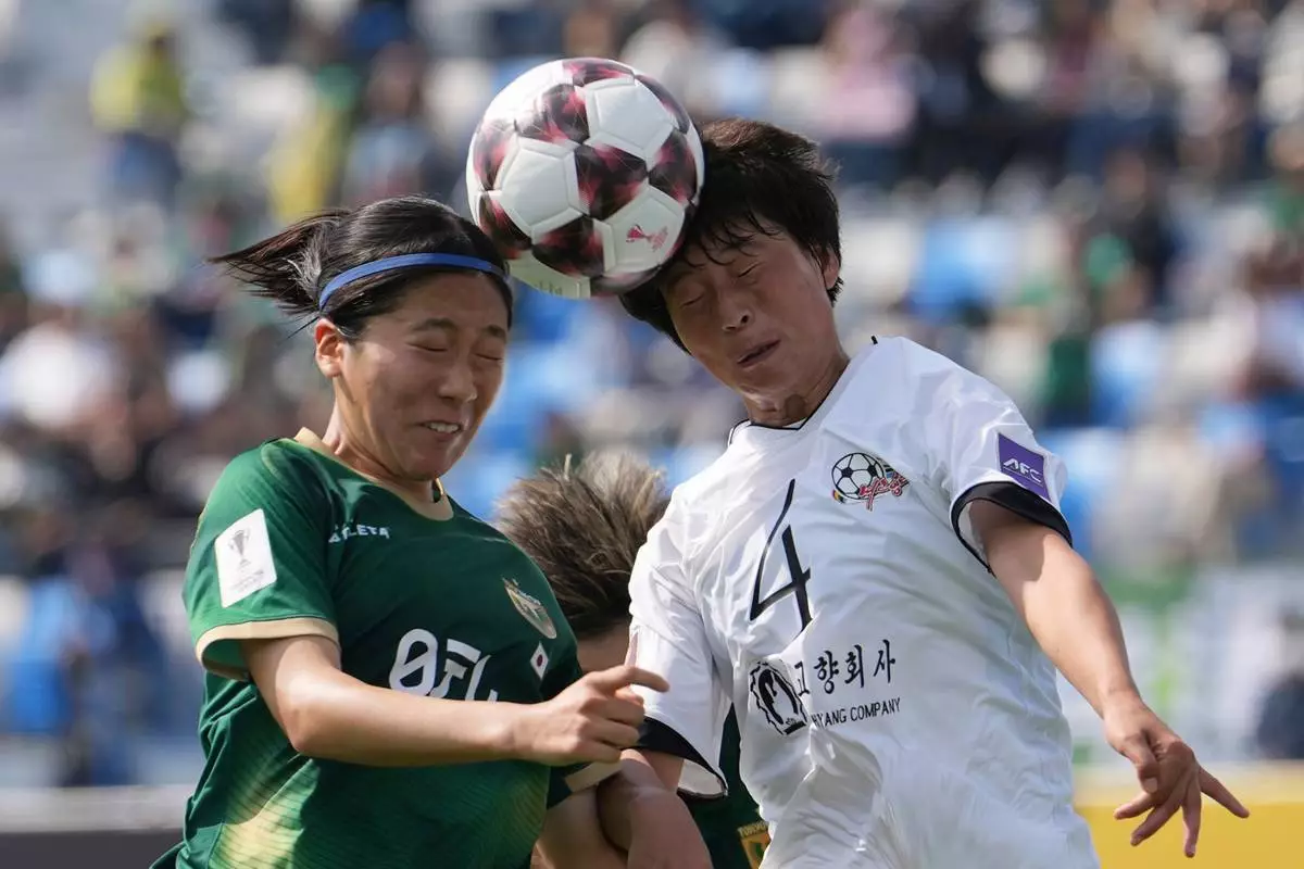 Naegohyang Women's FC's Ri Myong Gum, right, battles for the ball against Tokyo Verdy Beleza's Yuna Aoki during the AFC Women's Champions League soccer final match in Suwon, South Korea, Saturday, May 23, 2026. (AP Photo/Lee Jin-man)