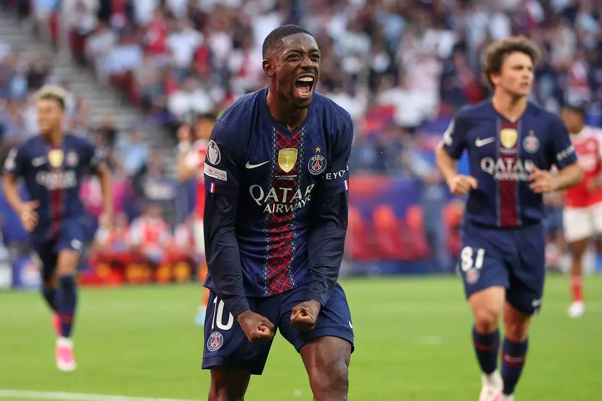 PSG's Ousmane Dembele celebrates after scoring from a penalty kick during the Champions League final soccer match between Paris Saint-Germain and Arsenal in Budapest, Hungary, Saturday, May 30, 2026. AP Photo/Armin Durgut)