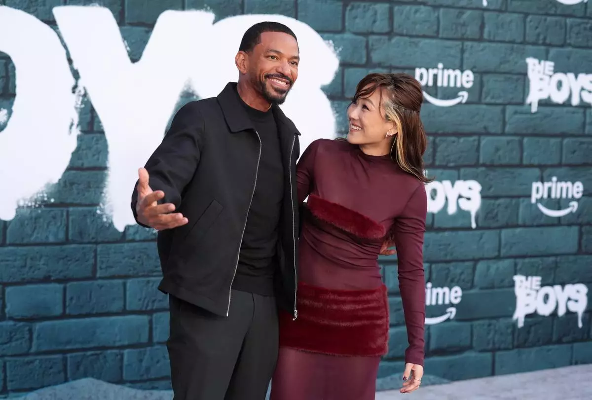 Cast members Laz Alonso, left, and Karen Fukuhara pose together at the premiere of the series finale of the fifth season of the Amazon Prime Video series "The Boys" on Tuesday, May 19, 2026, at The United Theater on Broadway in Los Angeles. (AP Photo/Chris Pizzello)