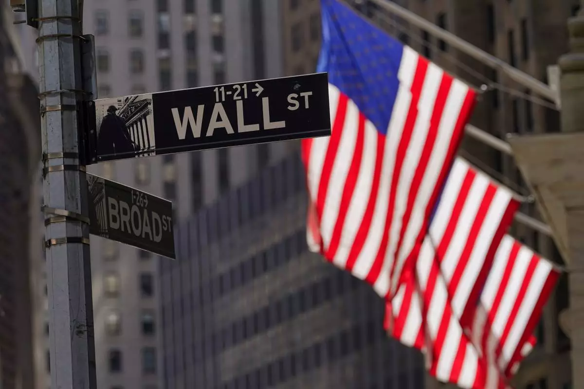 FILE - American flags fly outside the New York Stock Exchange, Friday, Sept. 23, 2022, in New York. (AP Photo/Mary Altaffer, File)