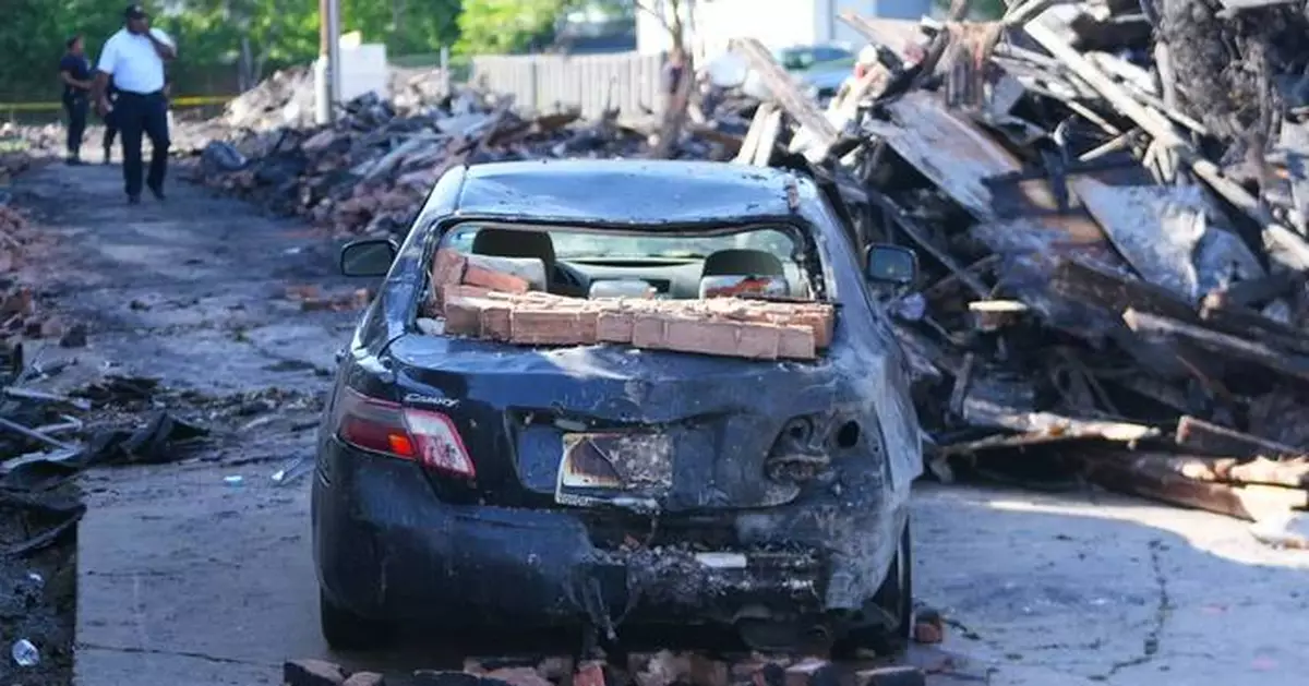 Crews scour the site of a deadly Dallas apartment blast and fire searching for more possible victims