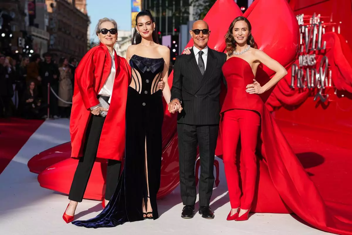 Meryl Streep, from left, Anne Hathaway, Stanley Tucci, and Emily Blunt pose for photographers upon arrival at the premiere of the film 'The Devil Wears Prada 2' on Wednesday, April 22, 2026, in London. (Photo by Scott A Garfitt/Invision/AP)