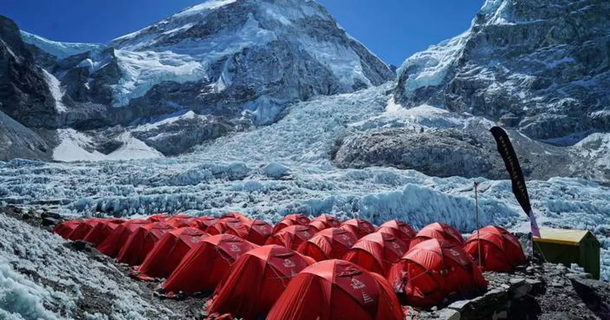 Mount Everest season opens late, with climbers undeterred by huge ice block and high travel costs