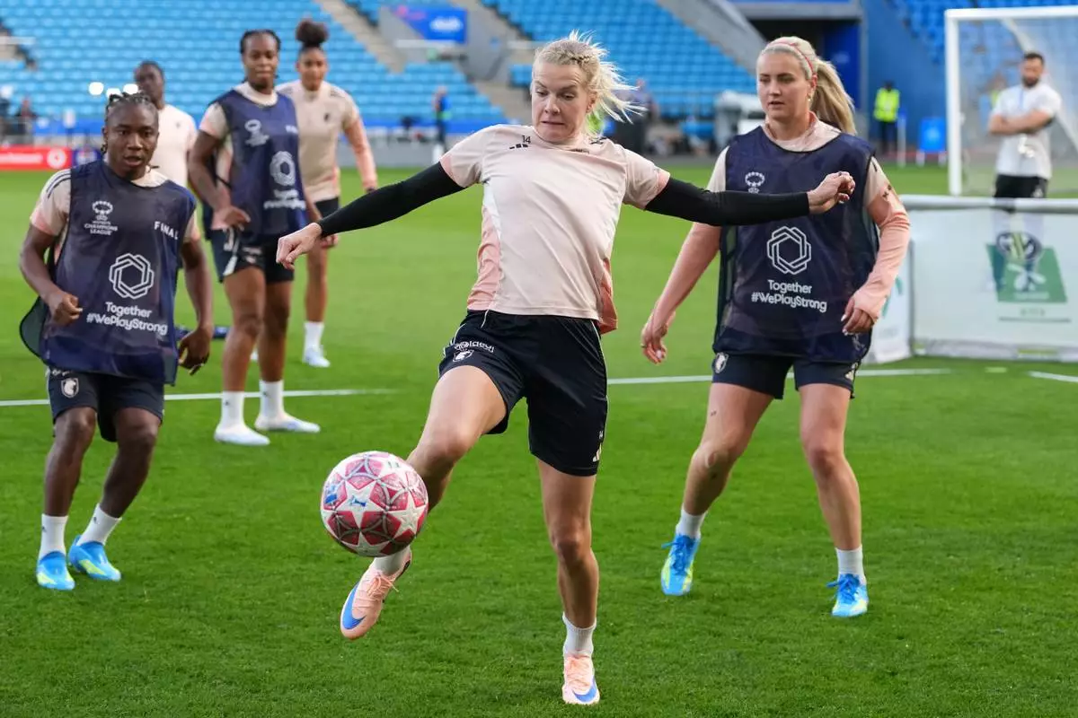 Lyonnes' Ada Hegerberg reaches for the ball during a training session on the eve of the Women's Champions League final soccer match between FC Barcelona and OL Lyonnes, in Oslo, Friday, May 22, 2026. (AP Photo/Kirsty Wigglesworth)