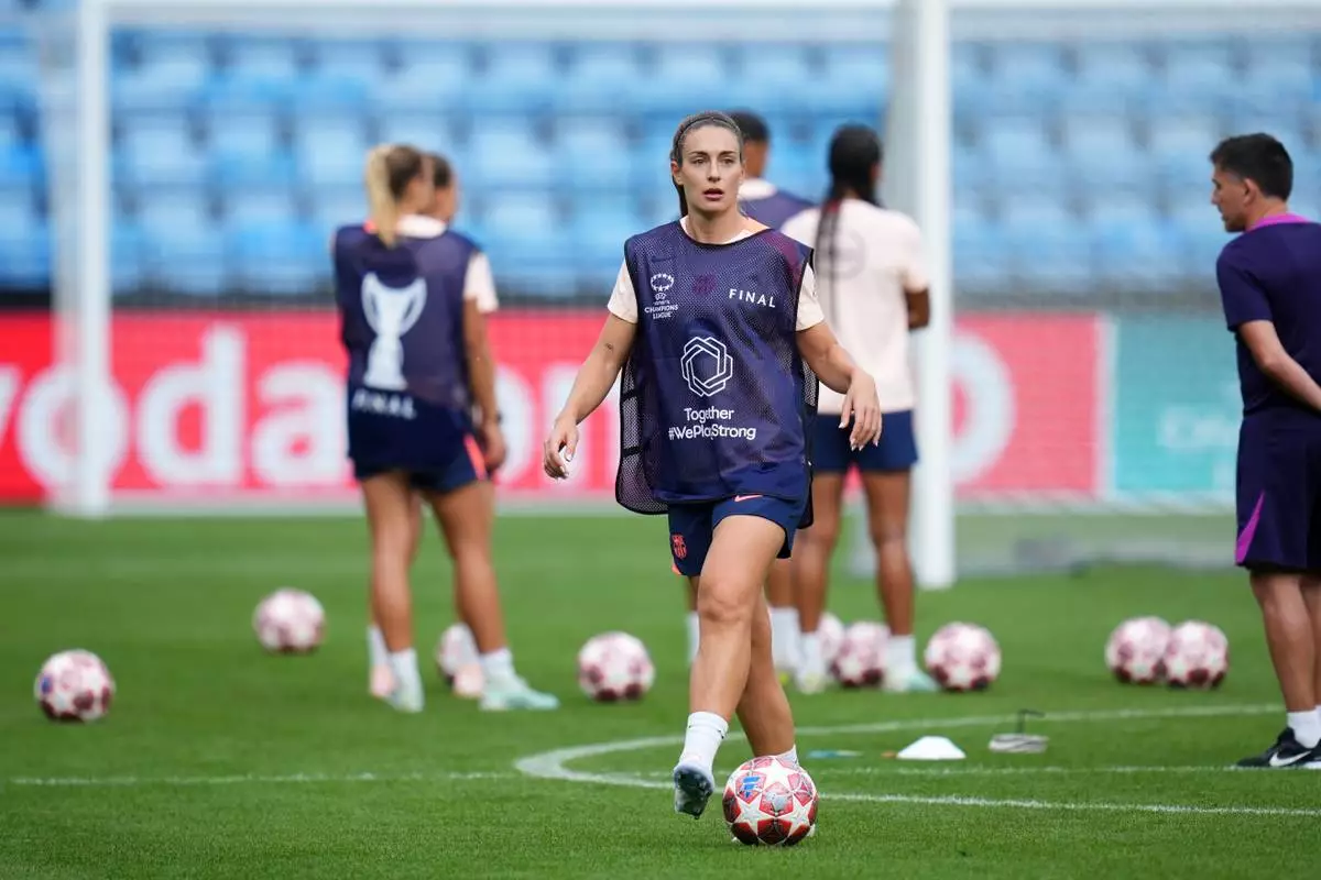 Barcelona's Alexia Putellas walks with a ball during a training session on the eve of the Women's Champions League final soccer match between FC Barcelona and OL Lyonnes, in Oslo, Friday, May 22, 2026. (AP Photo/Kirsty Wigglesworth)