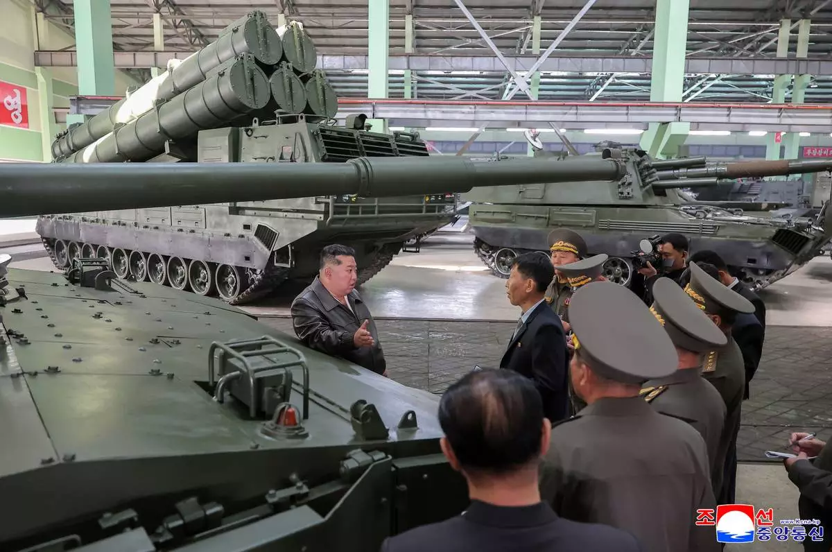 In this photo provided on May 8, 2026, by the North Korean government, its leader Kim Jong Un, center, visits a major munitions factory at an undisclosed location, North Korea Wednesday, May 6, 2026. Independent journalists were not given access to cover the event depicted in this image distributed by the North Korean government. The content of this image is as provided and cannot be independently verified. Korean language watermark on image as provided by source reads: "KCNA" which is the abbreviation for Korean Central News Agency. (Korean Central News Agency/Korea News Service via AP)