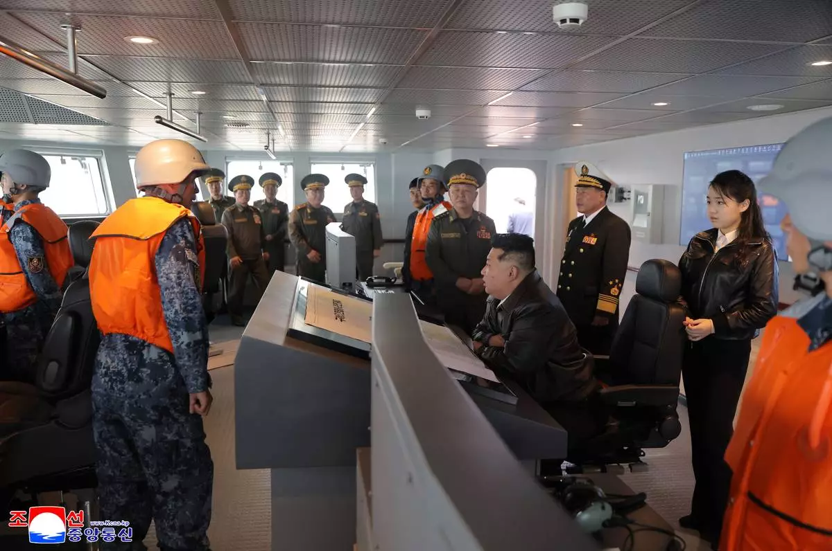 In this photo provided on May 8, 2026, by the North Korean government, its leader Kim Jong Un, center, and his daughter inspect the destroyer Choe Hyon off North Korea's west coast, Thursday, May 7, 2026. Independent journalists were not given access to cover the event depicted in this image distributed by the North Korean government. The content of this image is as provided and cannot be independently verified. Korean language watermark on image as provided by source reads: "KCNA" which is the abbreviation for Korean Central News Agency. (Korean Central News Agency/Korea News Service via AP)