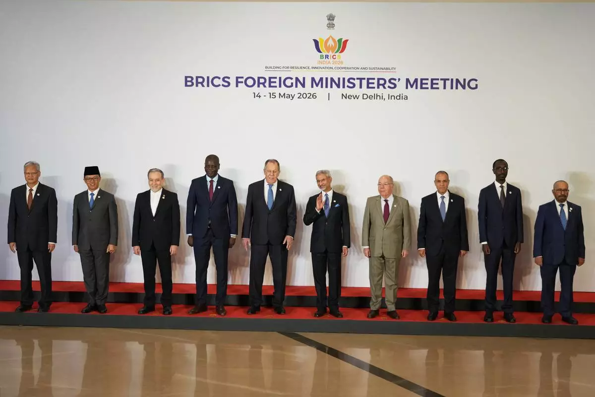 Foreign ministers and representatives of the BRICS nations, from right, UAE's Foreign Minister of State Khalifa bin Shaheen Al Marar, Ethiopia's Minister of Foreign Affairs Gedion Timothewos, Egypt's Foreign Minister Badr Abdelatty, Brazil's Foreign Minister Mauro Vieira, India's Foreign Minister S.Jaishankar, Russia's Foreign Minister Sergey Lavrov, South Africa's Minister of Foreign Affairs Ronald Lamola, Iranian Foreign Minister Abbas Araghchi, Indonesia's Foreign Minister Sugiono and Chinese Ambassador to India Xu Feihong pose for a group photo during a two-day meeting in New Delhi, India, Thursday, May 14, 2026. (AP Photo/Manish Swarup) CORRECTION: Name and designation corrected to UAE's Foreign Minister of State Khalifa bin Shaheen Al Marar, instead of UAE's Minister of State for International Cooperation Reem Al Hashimy.