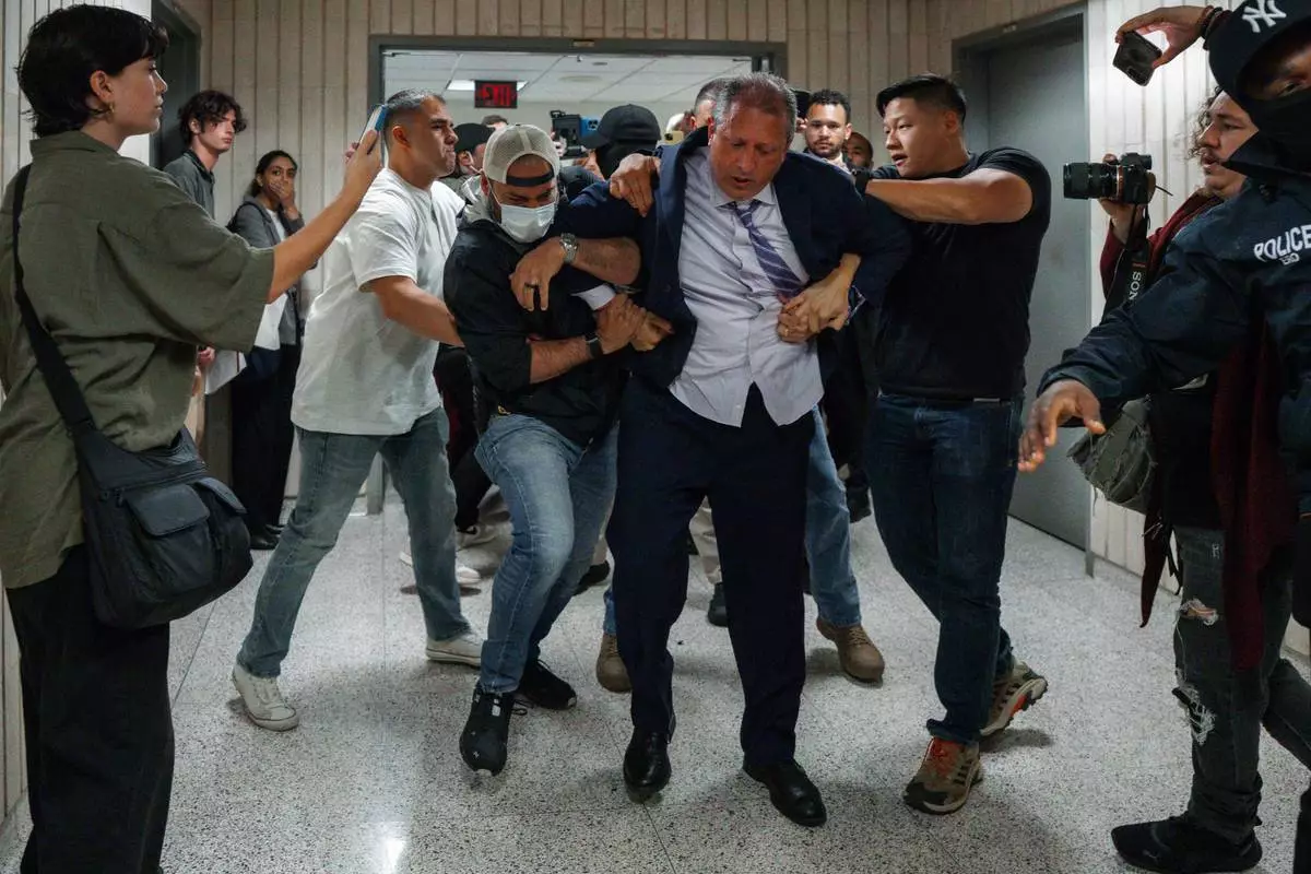 FILE - New York City Comptroller Brad Lander is arrested by Immigration and Customs Enforcement and FBI agents outside federal immigration court, June 17, 2025, in New York. (AP Photo/Olga Fedorova, File)