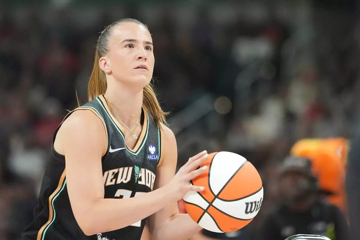 FILE - New York Liberty's Sabrina Ionescu shoots during the 3-point contest at the WNBA All-Star basketball weekend, July 18, 2025, in Indianapolis. (AP Photo/Michael Conroy, File)
