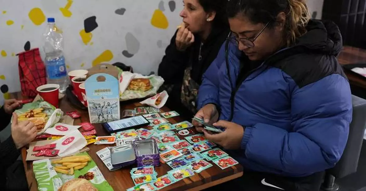 Argentine plazas buzz with World Cup sticker trading fever