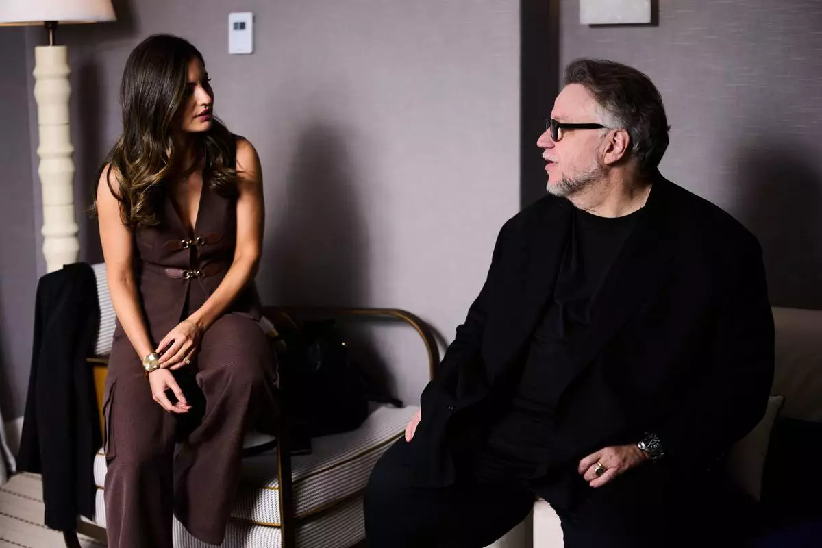 Director Guillermo del Toro, lright, and Ivana Baquero pose for portrait photographs for the 20th anniversary of the film 'Pan Labyrinth' at the 79th international film festival, Cannes, southern France, Tuesday, May 12, 2026. (Photo by Scott A Garfitt/Invision/AP)
