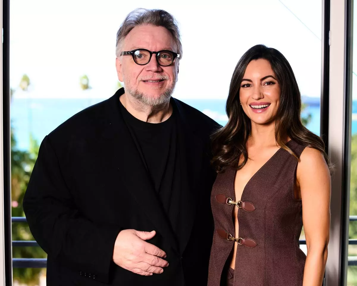 Director Guillermo del Toro, left, and Ivana Baquero pose for portrait photographs for the 20th anniversary of the film 'Pan Labyrinth' at the 79th international film festival, Cannes, southern France, Tuesday, May 12, 2026. (Photo by Scott A Garfitt/Invision/AP)