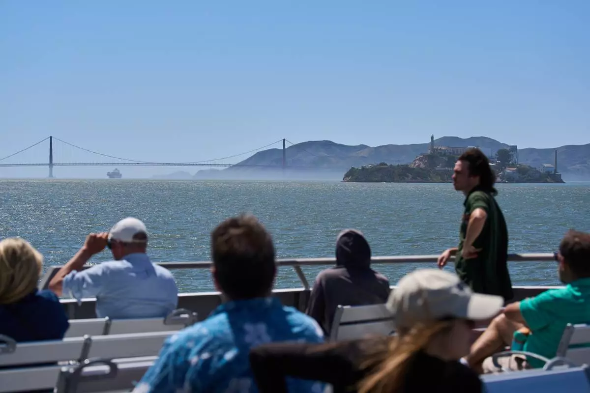 Passengers ride a San Francisco Bay ferry, Tuesday, May 19, 2026. (AP Photo/Annika Hammerschlag)