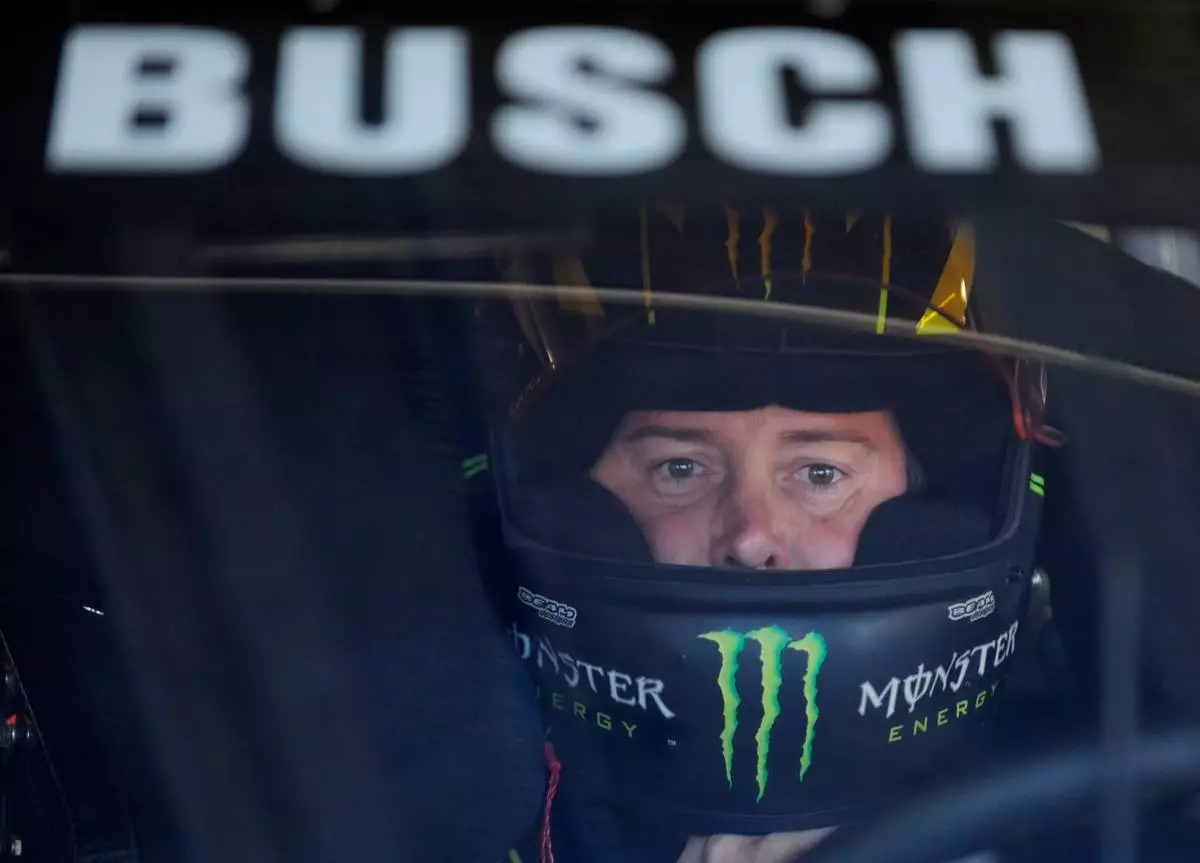 FILE - Kurt Busch waits in his car before practice for Sunday's NASCAR Sprint Cup series Coca-Cola 600 auto race at Charlotte Motor Speedway in Concord, N.C., Saturday, May 25, 2013. (AP Photo/Mike McCarn, File, File) CORRECTION: Driver ID corrected to Kurt Busch, not Kyle Busch.