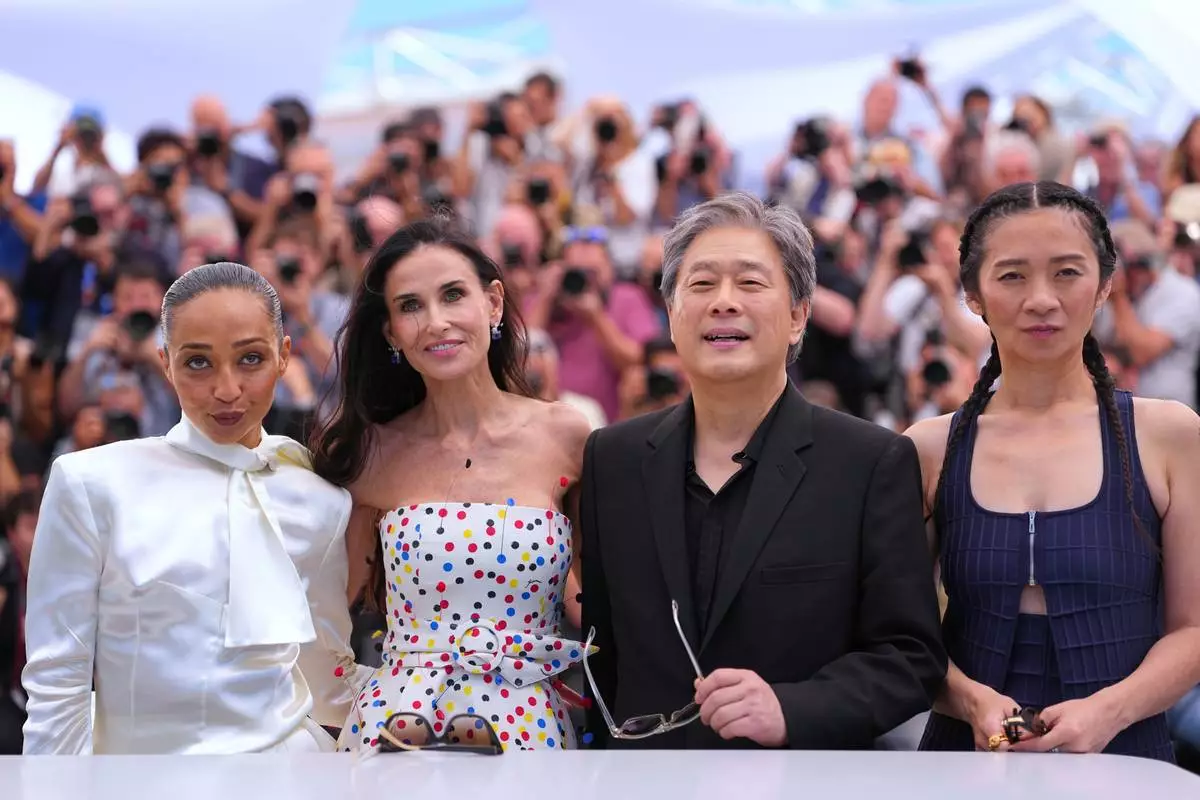 Jury president Park Chan-wook, third from left, poses with jury members Ruth Negga, from left, Demi Moore and Chloé Zhao at the jury photo call at the 79th international film festival, Cannes, southern France, Tuesday, May 12, 2026. (AP Photo/Andreea Alexandru)