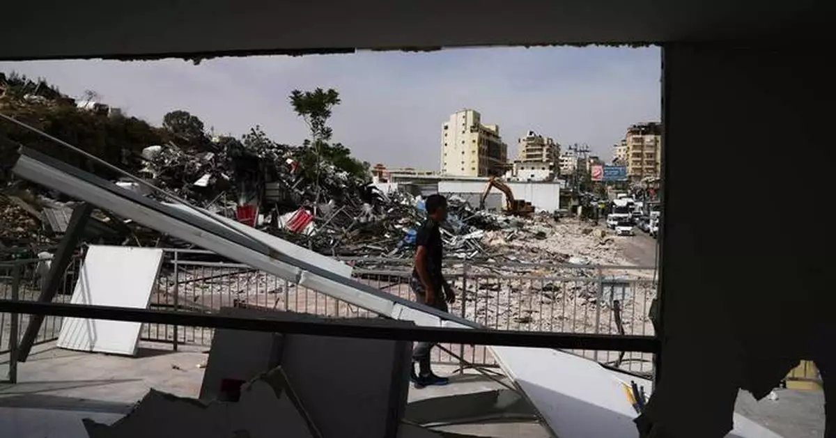Israeli bulldozers raze about 50 Palestinian shops ahead of settlement-linked road project
