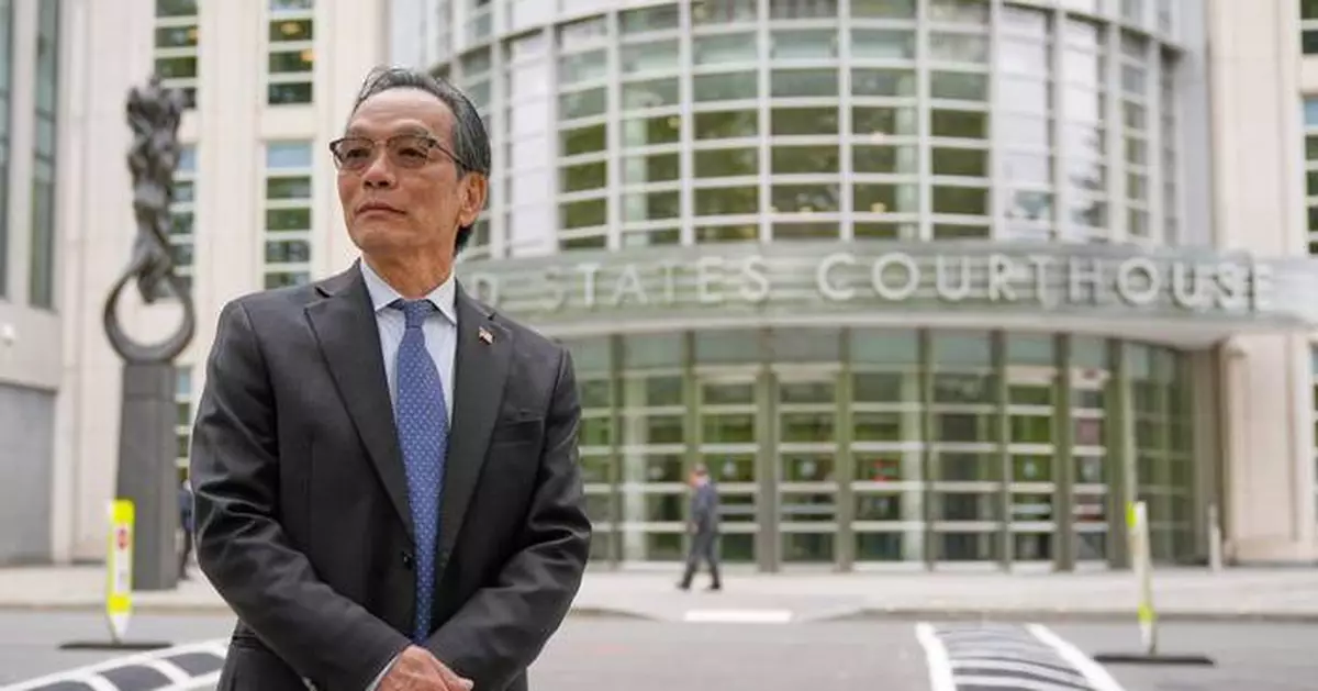 He's accused of running a Chinese spy outpost. His lawyer says it was a place to play ping-pong