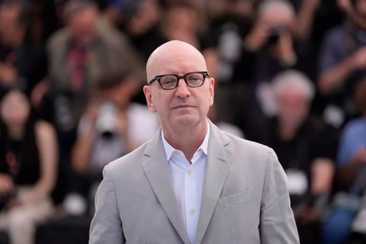 Director Steven Soderbergh poses for photographers at the photo call for the film 'John Lennon: The Last Interview' during the 79th international film festival, Cannes, southern France, Saturday, May 16, 2026. (AP Photo/John Locher)