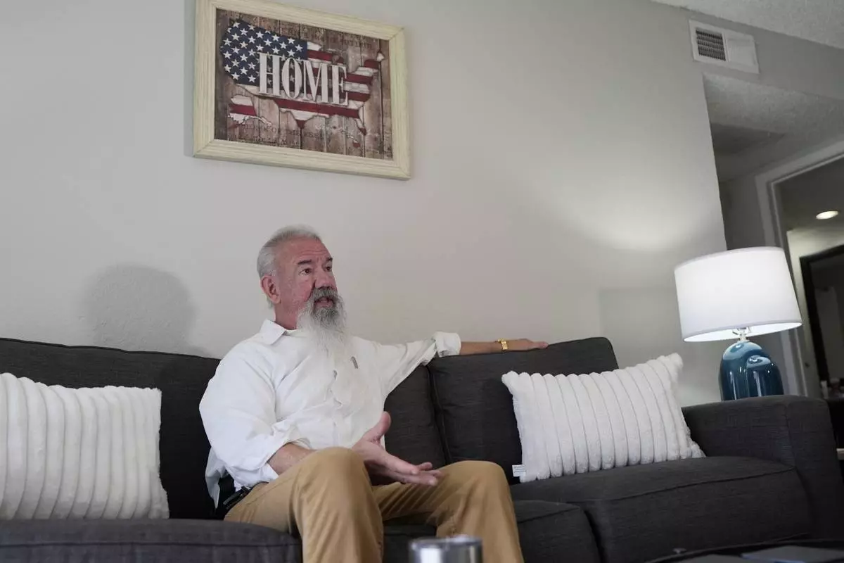 Matthew Haines, owner of the Oakwood Apartments responds to questions during an interview at the community housing location in Arlington, Texas, Tuesday, March 17, 2026. (AP Photo/Tony Gutierrez)