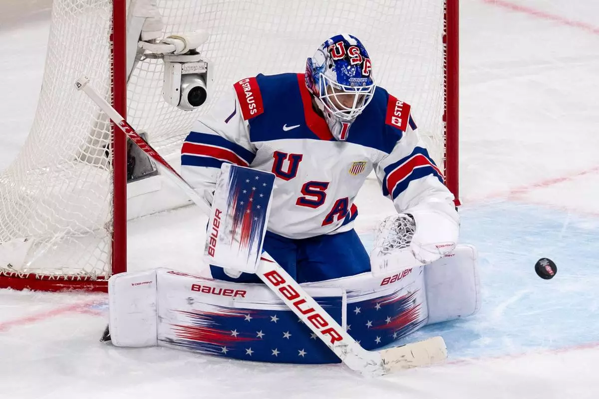 USA's goaltender Devin Cooley during the 2026 IIHF Men's Ice Hockey World Championship preliminary round group A match between Latvia and the United States in Zurich, Switzerland, Saturday, May 23, 2026. (Andreas Becker/Keystone via AP)