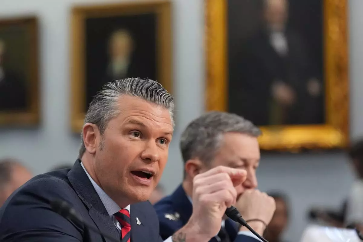 Defense Secretary Pete Hegseth testifies at a House Appropriations subcommittee budget hearing for the Department of Defense, Tuesday, May 12, 2026, in Washington, as Chairman of the Joint Chiefs of Staff Gen. Dan Caine listens. (AP Photo/Alex Brandon)