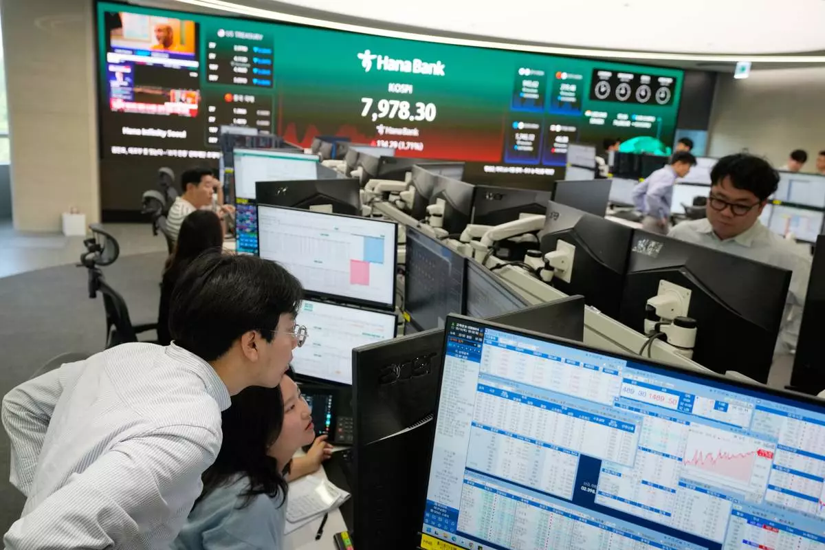 Currency traders work at the foreign exchange dealing room of the Hana Bank headquarters in Seoul, South Korea, Thursday, May 14, 2026. (AP Photo/Ahn Young-joon)