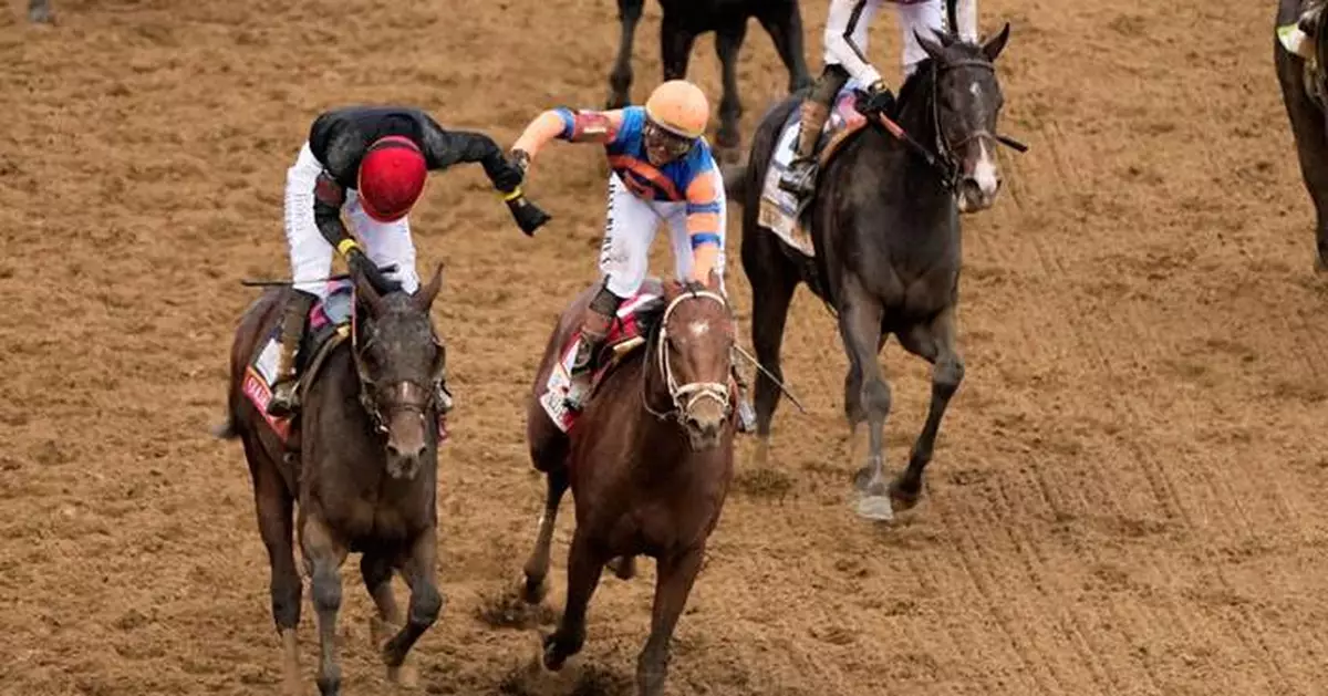 Jockey Jose Ortiz comes from last to pass brother Irad and win Kentucky Derby