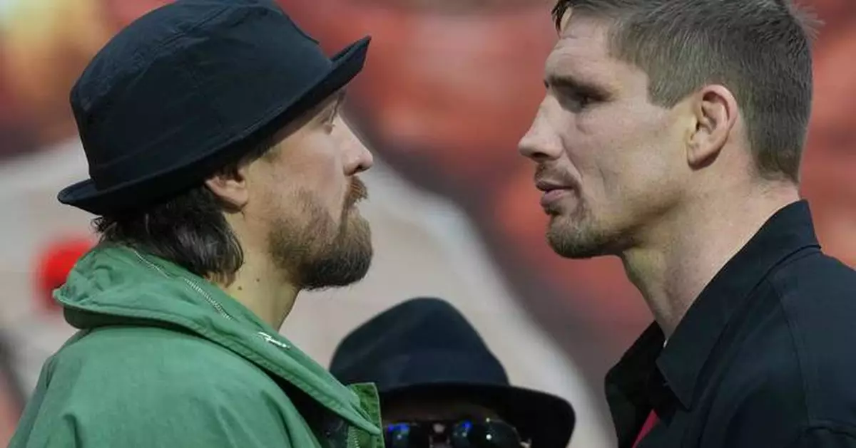Usyk stops kickboxer Verhoeven in 11th round of heavyweight title fight in Egypt