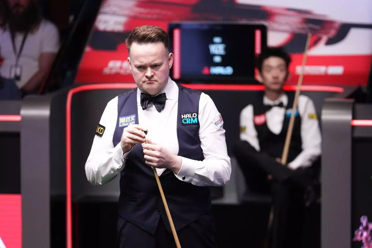 England's Shaun Murphy during his match against China's Wu Yize on day sixteen of the World Snooker Championship 2026 in Sheffield, England, Sunday, May 3, 2026. (Mike Egerton/PA via AP)